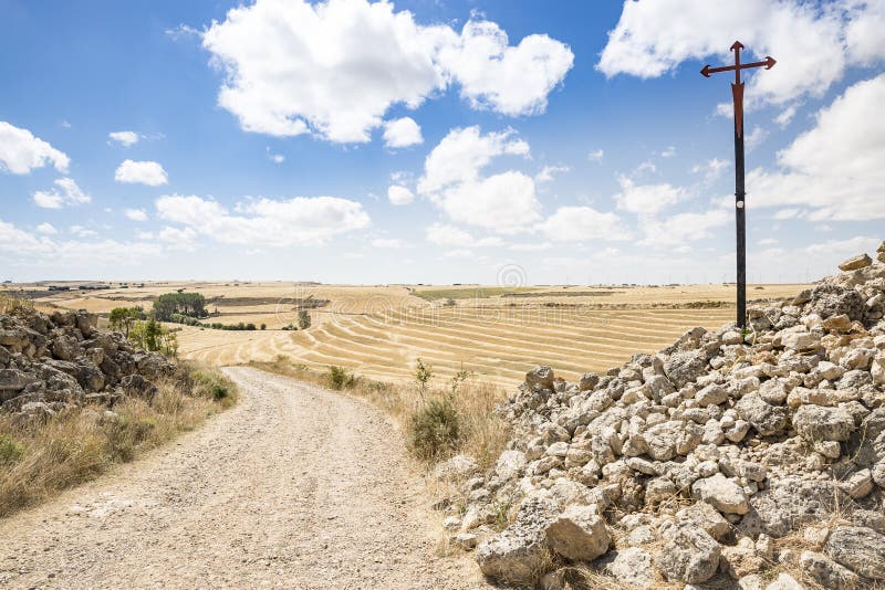 Santiago cross on a country road on a summer day between Hornillos del Camino and Hontanas, Burgos, Spain stock photo Santiago cross on a country road on a summer day between Hornillos del Camino and Hontanas, Burgos, Spain stock photo