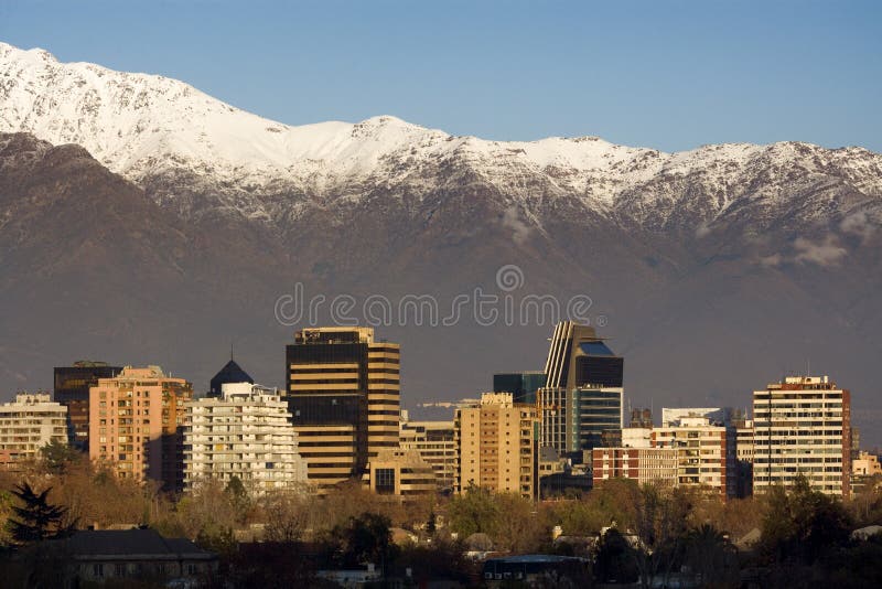 Skyline of Providencia district in Santiago de Chile with snowed Andes mountain range in the background. This is a wealthy residential and commercial district in the city.