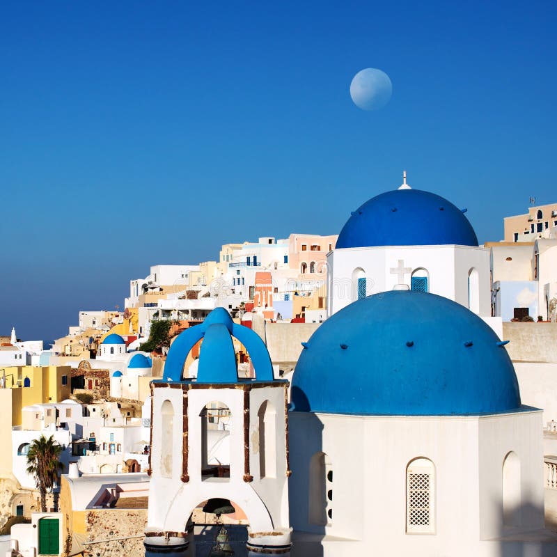 Santorini blue dome churches with moon. Oia Village, Greece. stock images Santorini blue dome churches with moon. Oia Village, Greece. stock images