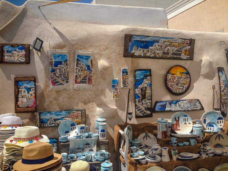 Santorini, Greece - September 10: Souvenir shop under the open sky, many beautiful paintings, pottery, Santorini, Greece. View