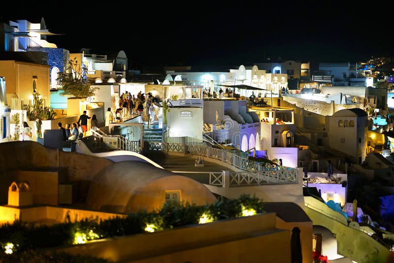 Santorini, Greece, September 19 2018, Tourists from all the world who stroll in the evening through the streets of Oia stock photos Santorini, Greece, September 19 2018, Tourists from all the world who stroll in the evening through the streets of Oia stock photos