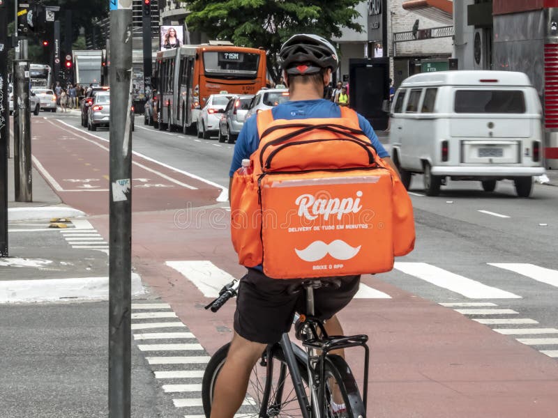 worker Rappi app on the bicycle delivers food stock images worker Rappi app on the bicycle delivers food stock images