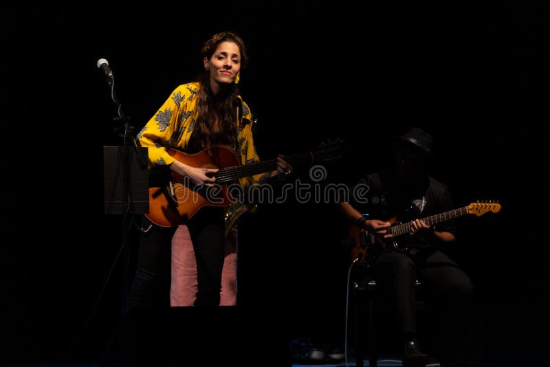 Sara Alhinho sings at a small concert at the Cultural Center of Portugal, Praia, Cape Verde. January 09, 2020 stock image Sara Alhinho sings at a small concert at the Cultural Center of Portugal, Praia, Cape Verde. January 09, 2020 stock image