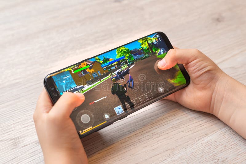 App Store vs Epic Games. Concept. App Store icon seen on ipad and Epic Games Fortnight icon seen on android phone. Selective focus. Stafford, UK, May Stock Photo - Alamy
