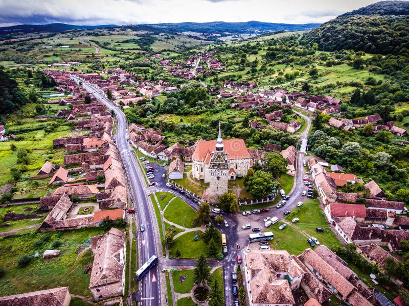 Saschiz saxon village and fortified Church in middle Transylvania, Romania, Eastern Europe. Aerial view from a drone. stock photography Saschiz saxon village and fortified Church in middle Transylvania, Romania, Eastern Europe. Aerial view from a drone. stock photography