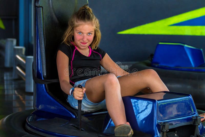 Sassy Young Girl On a Bumper Car Ride Looking at the Camera in a royalty free stock images Sassy Young Girl On a Bumper Car Ride Looking at the Camera in a royalty free stock images
