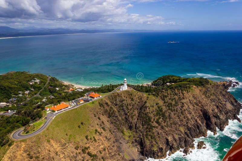 Wategoes Beach aerial view at Byron Bay with lighthouse gyrocopter australia ocean travel blue sea tourism water coast east holiday landscape shore australian nature new sky summer vacation beautiful coastline rocks sand south wales pass turquoise nsw clear main sunny tropical scenic sunshine green outdoor coastal waves seascape beauty building. Wategoes Beach aerial view at Byron Bay with lighthouse gyrocopter australia ocean travel blue sea tourism water coast east holiday landscape shore australian nature new sky summer vacation beautiful coastline rocks sand south wales pass turquoise nsw clear main sunny tropical scenic sunshine green outdoor coastal waves seascape beauty building