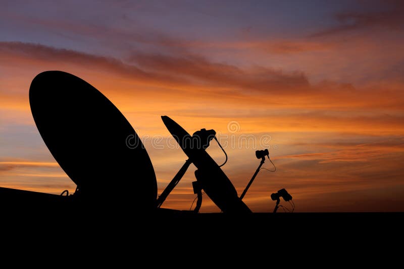 Satellite dish antenna at sunset