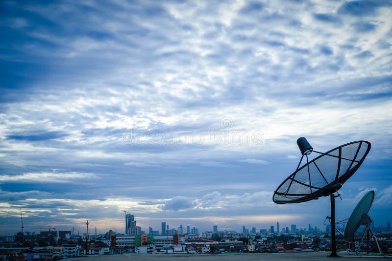 Satellite dish antenna on top of the building in urban area stock photos Satellite dish antenna on top of the building in urban area stock photos