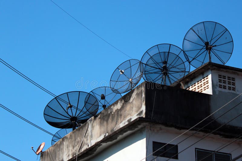 Satellite dish antennas on a rooftop.