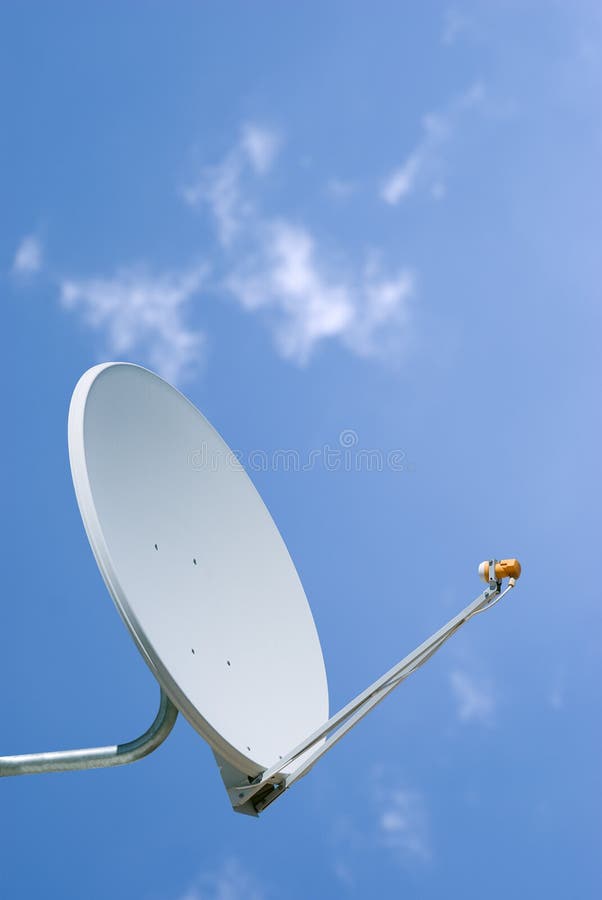 Satellite Dish Set Against a Blue Sky Stock Photo Image of