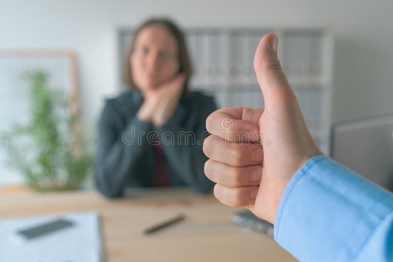 Satisfied boss gesturing thumbs up to female employee royalty free stock images Satisfied boss gesturing thumbs up to female employee royalty free stock images