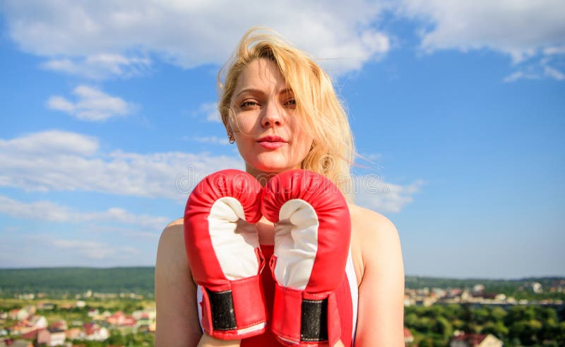 Satisfied free girl boxing gloves. Femininity and strength balance. She fighter female rights. Assert her point of view