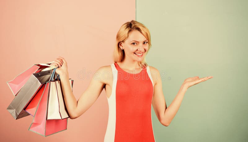 Satisfied with her shopping. Discounts and loyalty program. Save money. Easy way of shopping. Woman on shopping tour. Girl with paper bags. Black friday. Happy royalty free stock images Satisfied with her shopping. Discounts and loyalty program. Save money. Easy way of shopping. Woman on shopping tour. Girl with paper bags. Black friday. Happy royalty free stock images