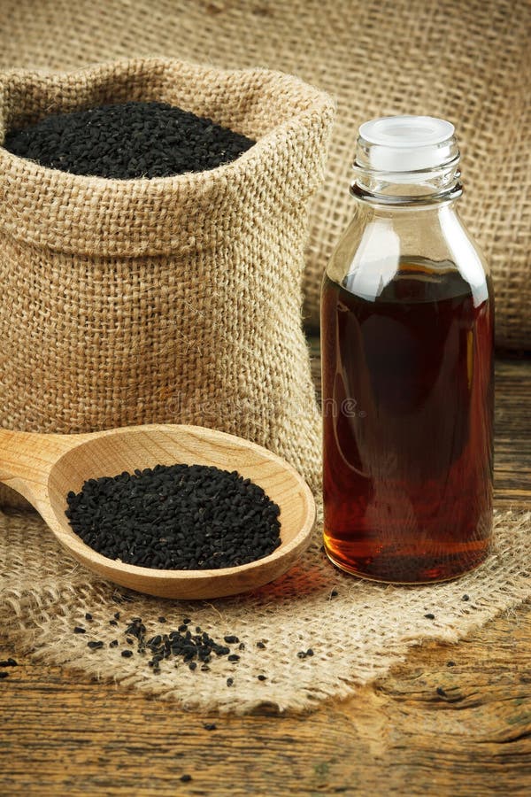 Sativaöl Nigella stockbild