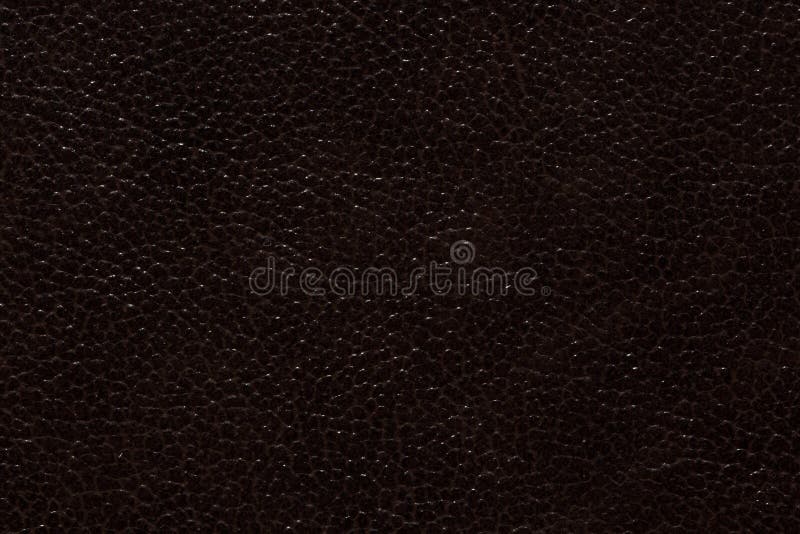 Saturated leather texture in expensive dark tone.