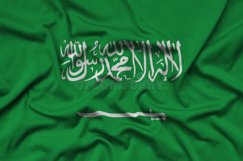 Saudi Arabia flag is depicted on a sports cloth fabric with many folds. Sport team banner stock photos Saudi Arabia flag is depicted on a sports cloth fabric with many folds. Sport team banner stock photos