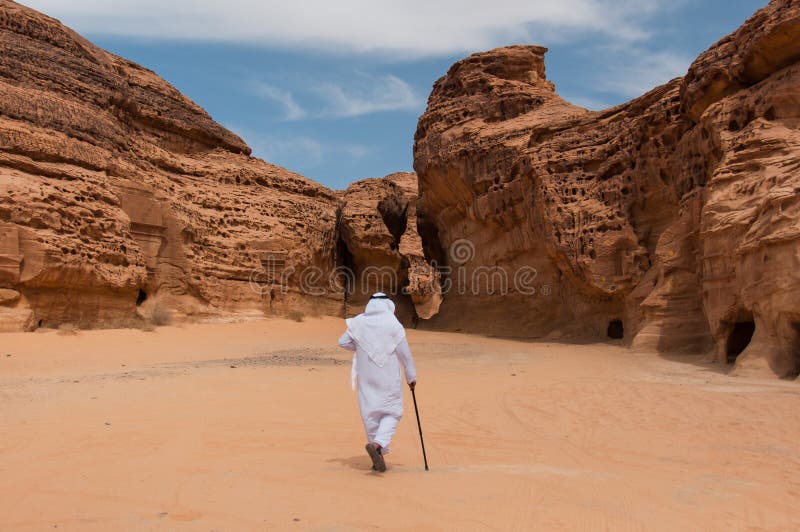 Saudian walking in MadaÃ®n Saleh archeological site, Saudi Arabi stock image