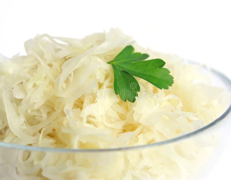 Bowl of sauerkraut with leaves.