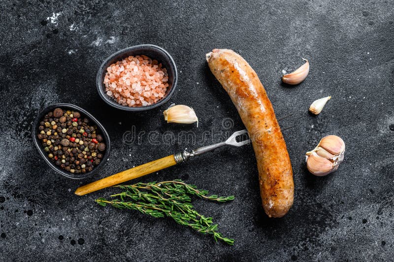 Sausage Barbecue Fried with Spices and Herbs on a Meat Fork. Top View