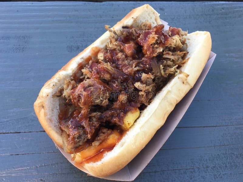 Sausage Dog with Pulled Pork, Pineapple and Red Sauce Stock Image