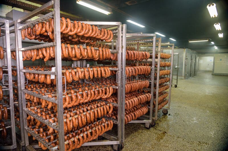 Meat sausage processing in factory