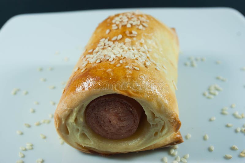 Sausage Roll in the Dough on a White Plate Stock Photo Image of