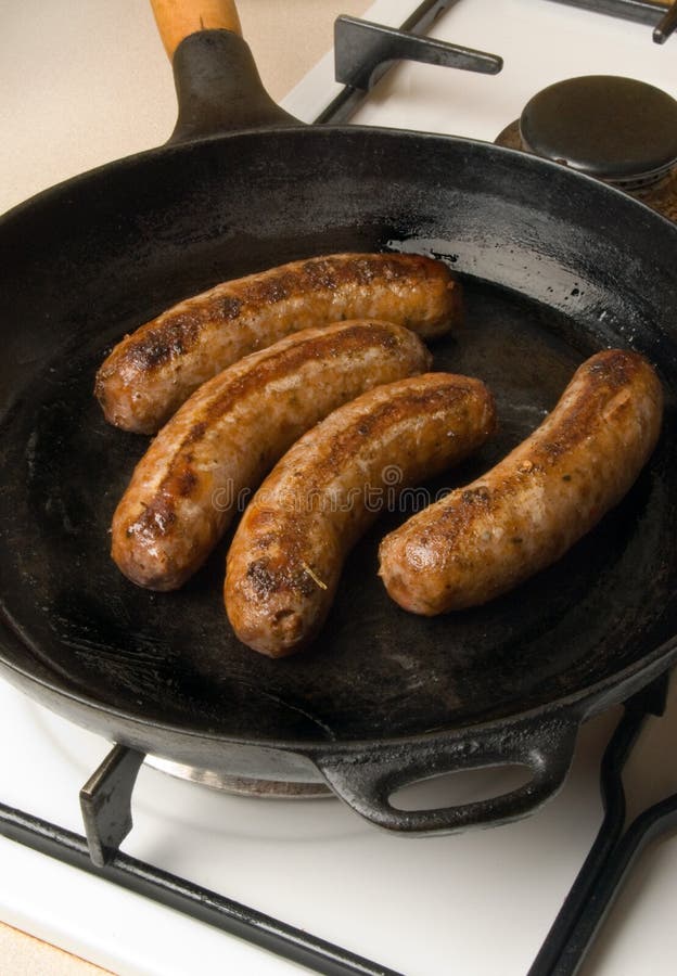 Sausages in a Black Frying Pan with Gas Stove Stock Photo Image of
