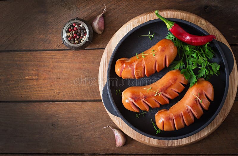 Sausages on the grill. Top view