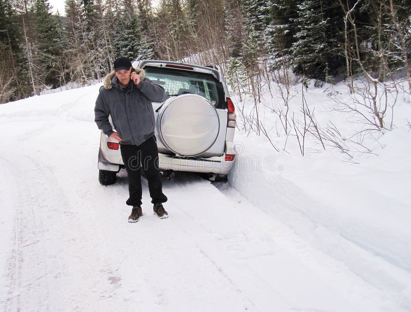 Man calling car rescue after driving his van into the ditch. Man calling car rescue after driving his van into the ditch