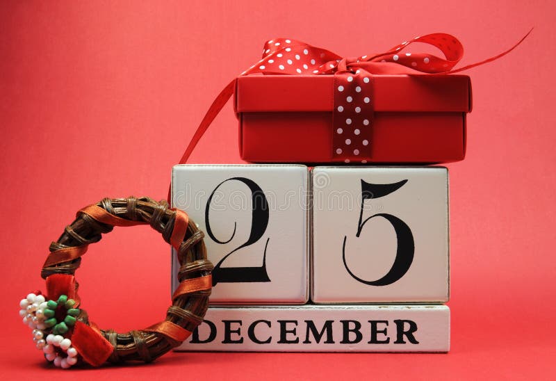 Save the Date for Christmas day with this white wooden blocks calendar for December 25, with a festive red present gift