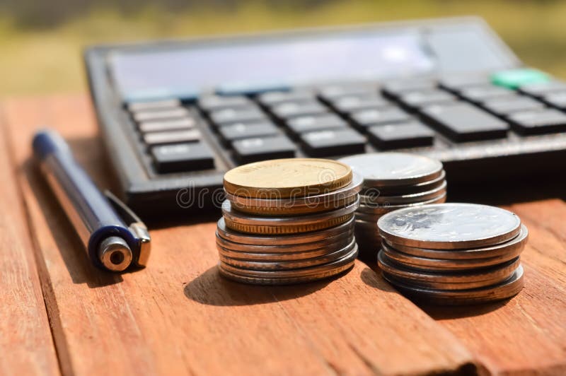 Saving Account from Bank for Business Finance with pen, calculator and coin