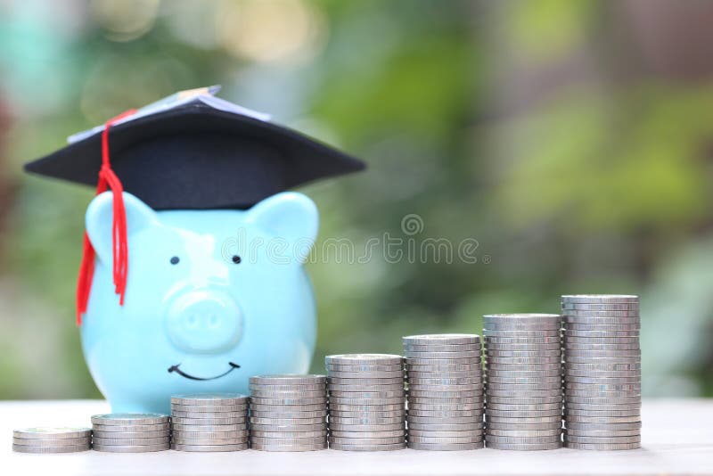 Saving money for education concept, Growing stack of coins money with graduation hat on piggy on nature green background