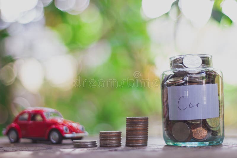 Saving money in a glass bottle vintage. Saving money concept stock photography