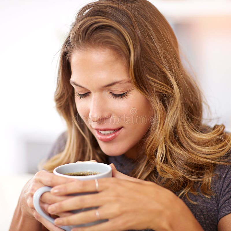 Savoring the First Cup of the Day. a Young Woman Having Coffee at Home