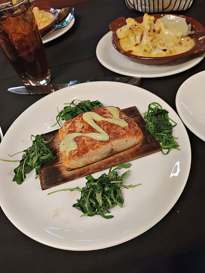 Savory Elegance, Roasted Salmon with Arugula Culinary Delight Stock