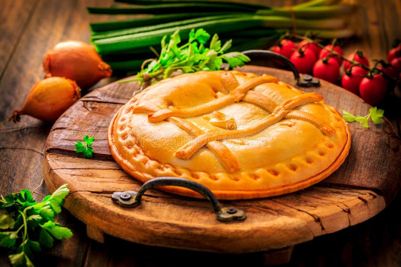 Savory tart with tuna and veggies, traditional Spanish empanada royalty free stock images
