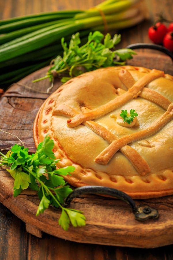 Savory tart with tuna and veggies, traditional Spanish empanada royalty free stock photos