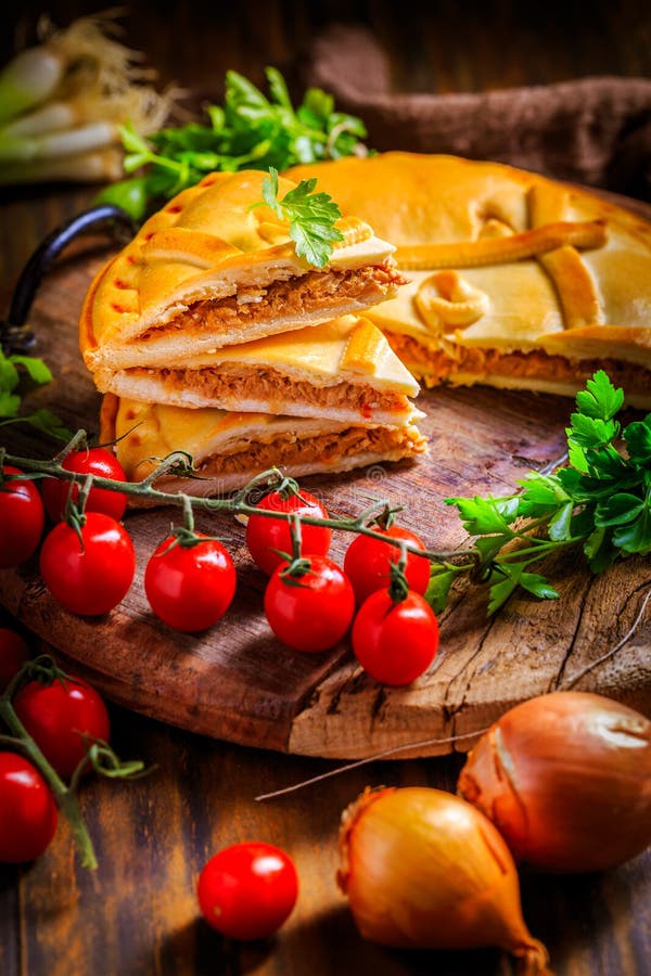 Savory tart with tuna and veggies, traditional Spanish empanada royalty free stock photos