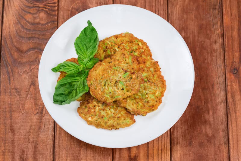 Savory Thick Zucchini Pancakes on Dish on Old Rustic Table Stock Image Image of greens, basil