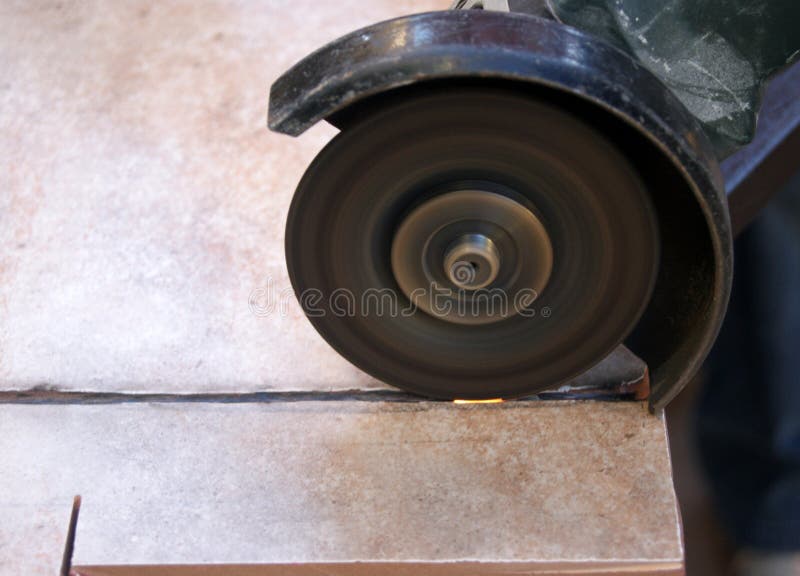 Saw cutting ceramic tile stock photography