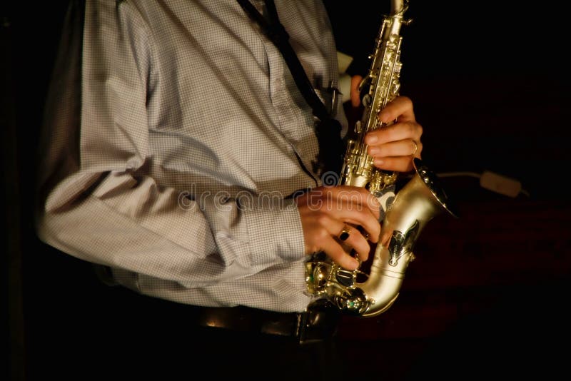 African American Jazz Musician Playing the Saxophone. Stock Photo