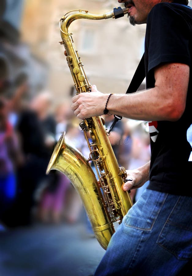 Saxofoonspeler royalty-vrije stock afbeeldingen Saxofoonspeler royalty-vrije stock afbeeldingen