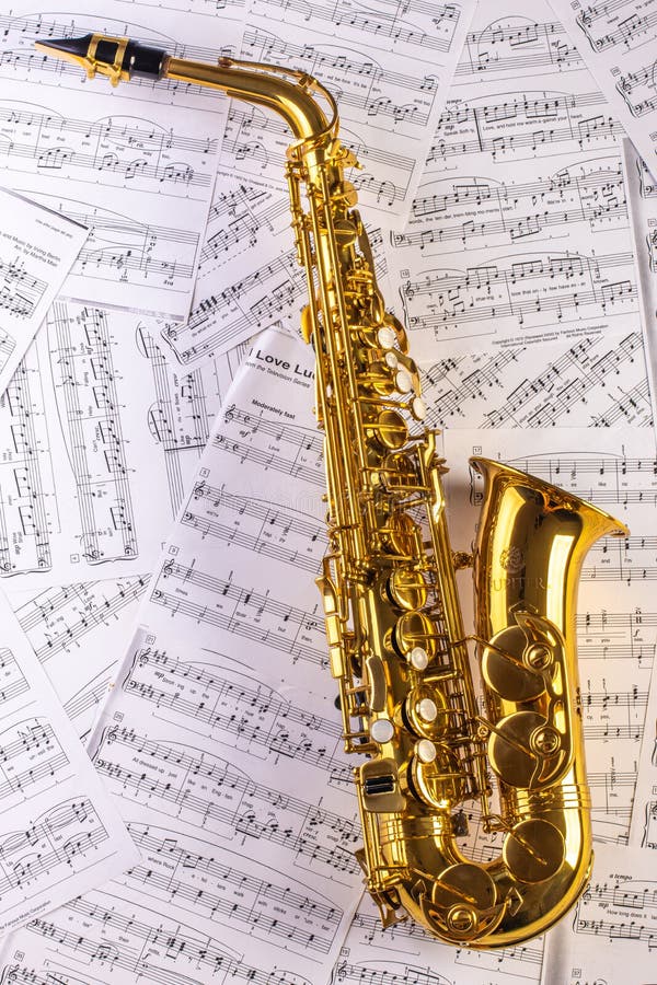 Saxophone Against A Background Of Sheet Music. Stock Image Image of
