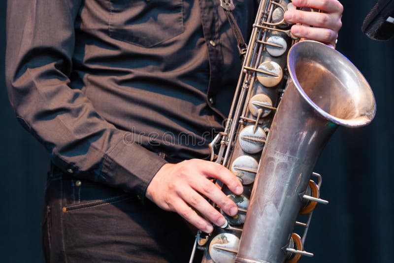 Saxophonist playing a tenor saxophone