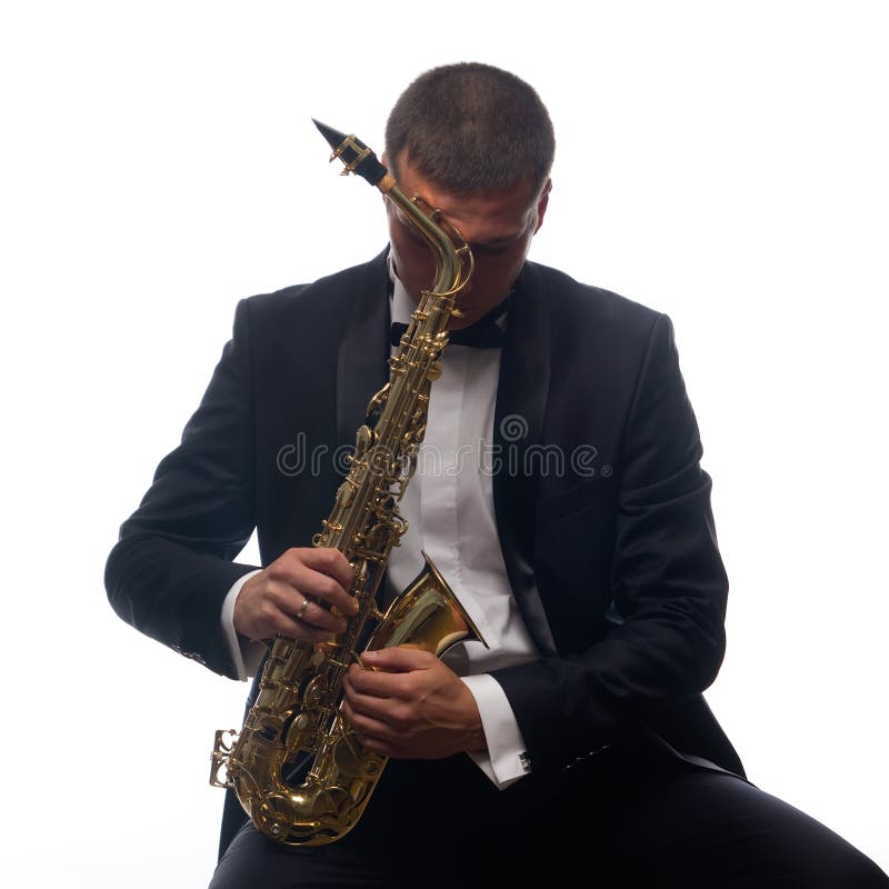 Saxophonist in tuxedo royalty free stock photos