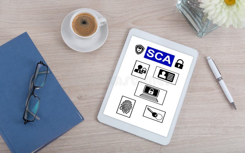 Top view of a desk with sca concept on a digital tablet
