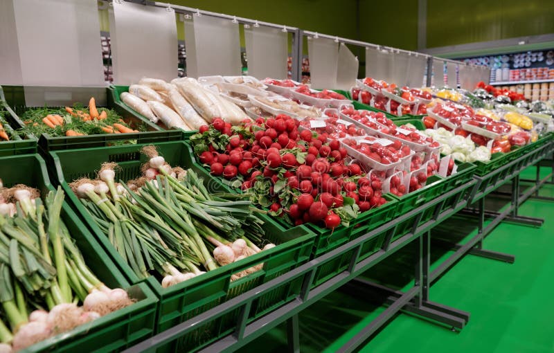 Shelf with fresh vegetables in grocery departament of a supermarket. Shelf with fresh vegetables in grocery departament of a supermarket