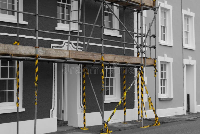 Scaffolding on the front of a house. Edited with selective colour. Scaffolding frame stock images, royalty-free photos and pictures