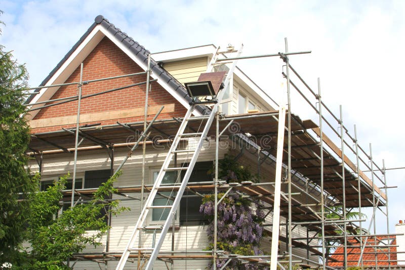 Scaffolding tower renovation, modern family home under construction